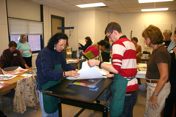 Students and instructors work on printmaking projects at Memorial Hall